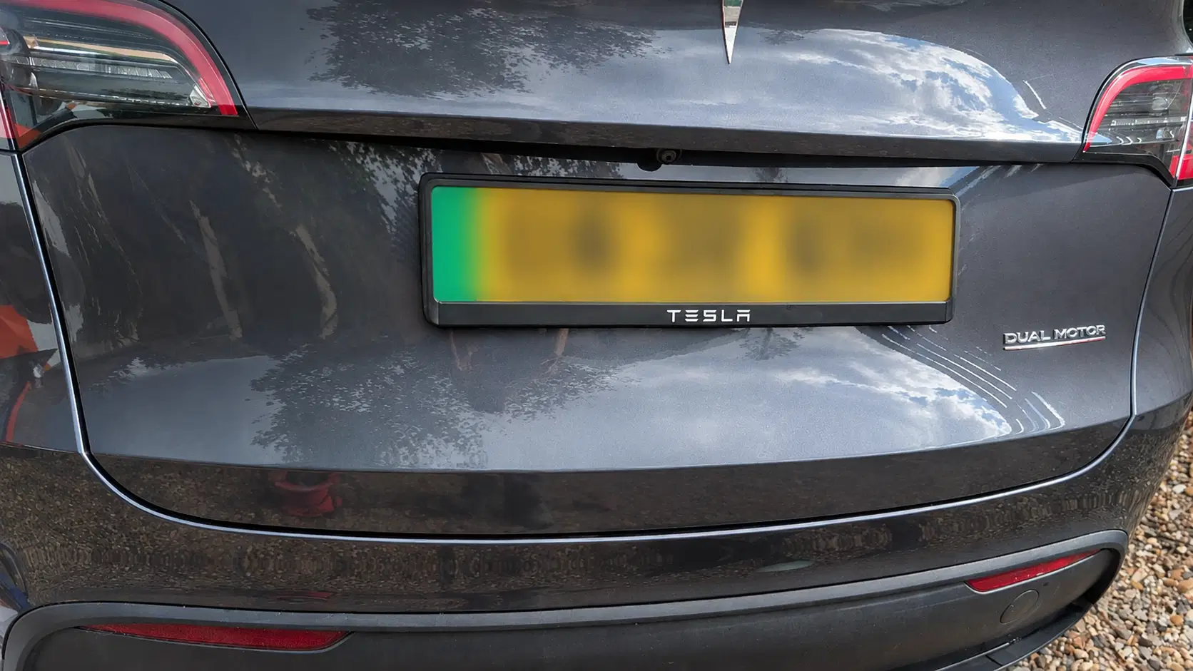 Rear of a grey Tesla vehicle